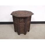 Eastern hexagonal occasional table, Heavily carved foliate decoration to the top and pierced