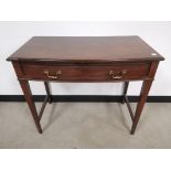 Mahogany side table, With single frieze full length drawer raised on tapered legs.