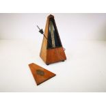 Cased Maezel Metronome, 22cm x 12cm x 12cm.