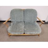 Mid 20th Century Ercol Windsor 203 two seater arm chair, With turqiouse upholstered cushions.