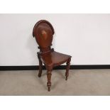 Mahogany chair with carved scroll decoration, Raised on turned supports.