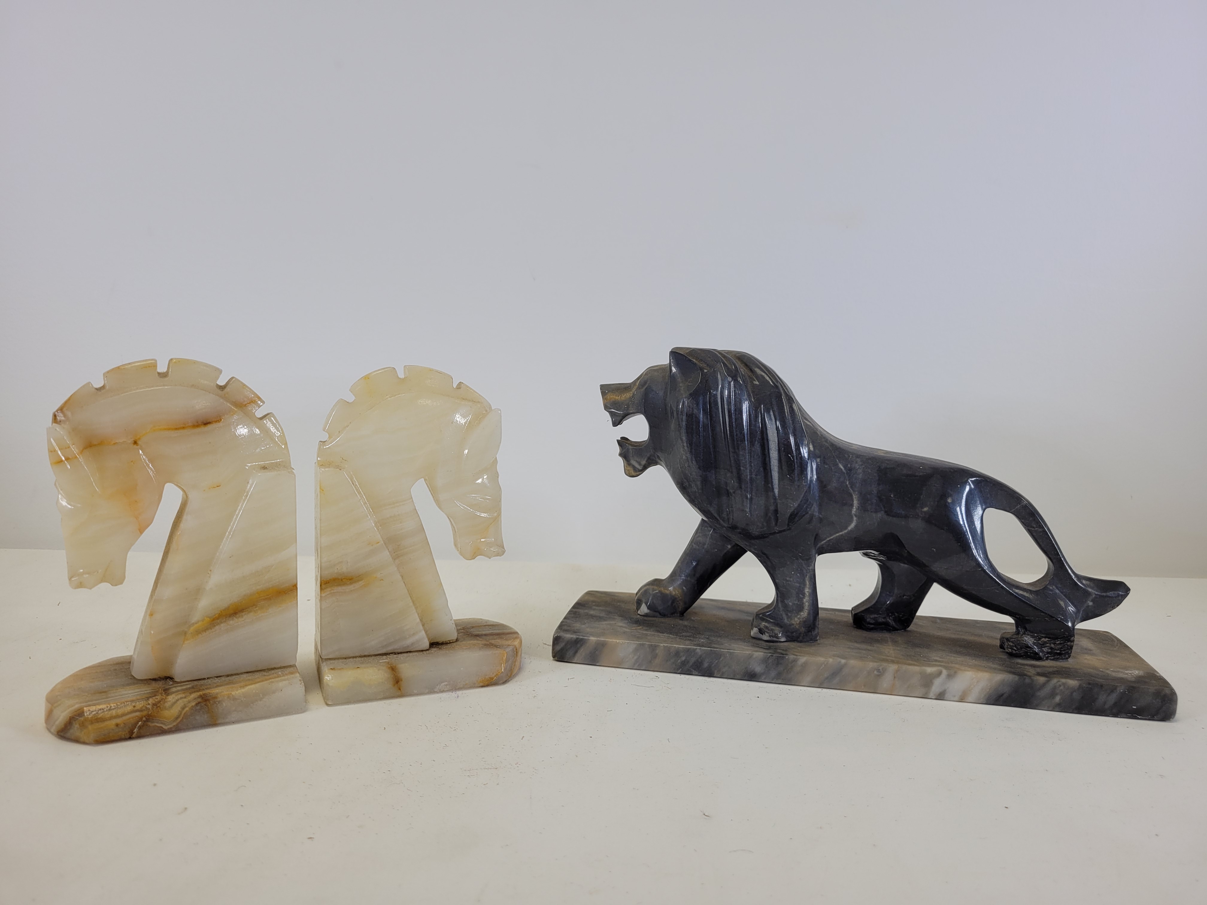 An Art Deco era carved and polished stone figure of a prowling lion, on a rectangular base, height - Image 2 of 3