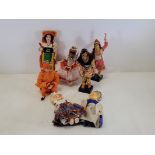 A small collection of dolls of the world, in traditional costumes, to include Middle Eastern, Indian