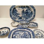 An assortment of predominantly British blue and white pottery, including a small pearlware dish with