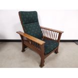 Early 20th Century oak framed American style adjustable arm chair, With spindle gallery supports