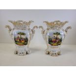 A pair of Continental porcelain vases with hand painted cartouches of courting couples in a rural