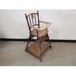 19th Century oak folding high chair, With turned spindle supports, folding foot rest, hinged to