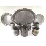 Victorian pewter quart measure, together with a quantity of pewter tankards and serving dishes,