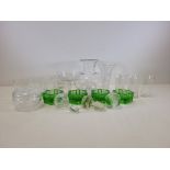 A quantity of mixed 20th Century glassware to include a jug, four six sided green table salts and