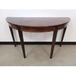 Mahogany demi lune side table, With border inlay, raised on tapered leg (one rear leg a/f)