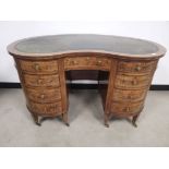 19th Century mahogany and walnut kidney shaped kneehole desk, With foliate marquetry and border