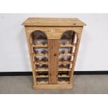 Modern pine bottle rack, With gaps to hold up to 24 bottles.