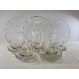 An early 20th Century glass serving set of floriform shape, to include graduated dishes, the largest