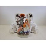 A pair of Staffordshire pottery spaniels, together with a Victorian Staffordshire flatback figure of