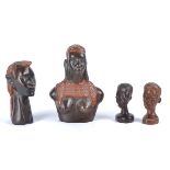 Four 20th Century African tribal ebonised treen carvings, three busts and one of the upper torso,