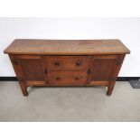 Oak sideboard with two central drawers, Flanked with cupboard to each side. Raised on square