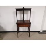 19th Century oak floor standing book press, single full length drawer, raised on tapered supports.