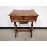 Burr walnut sewing table, with lidded compartment and carved pierced supports. 55cm W x 40cm D x