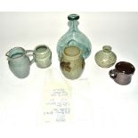 A collection of stoneware and terracotta contemporary studio pottery, including a John Reeve ash
