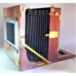 A late 19th Century mahogany and brass 12in x 16in Tailboard Camera, maker's plate missing, but