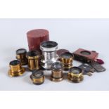 A Group of Small Brass Lenses, including a Busch Rapid Aplanat No 2, a Cooke Series III 5in, a