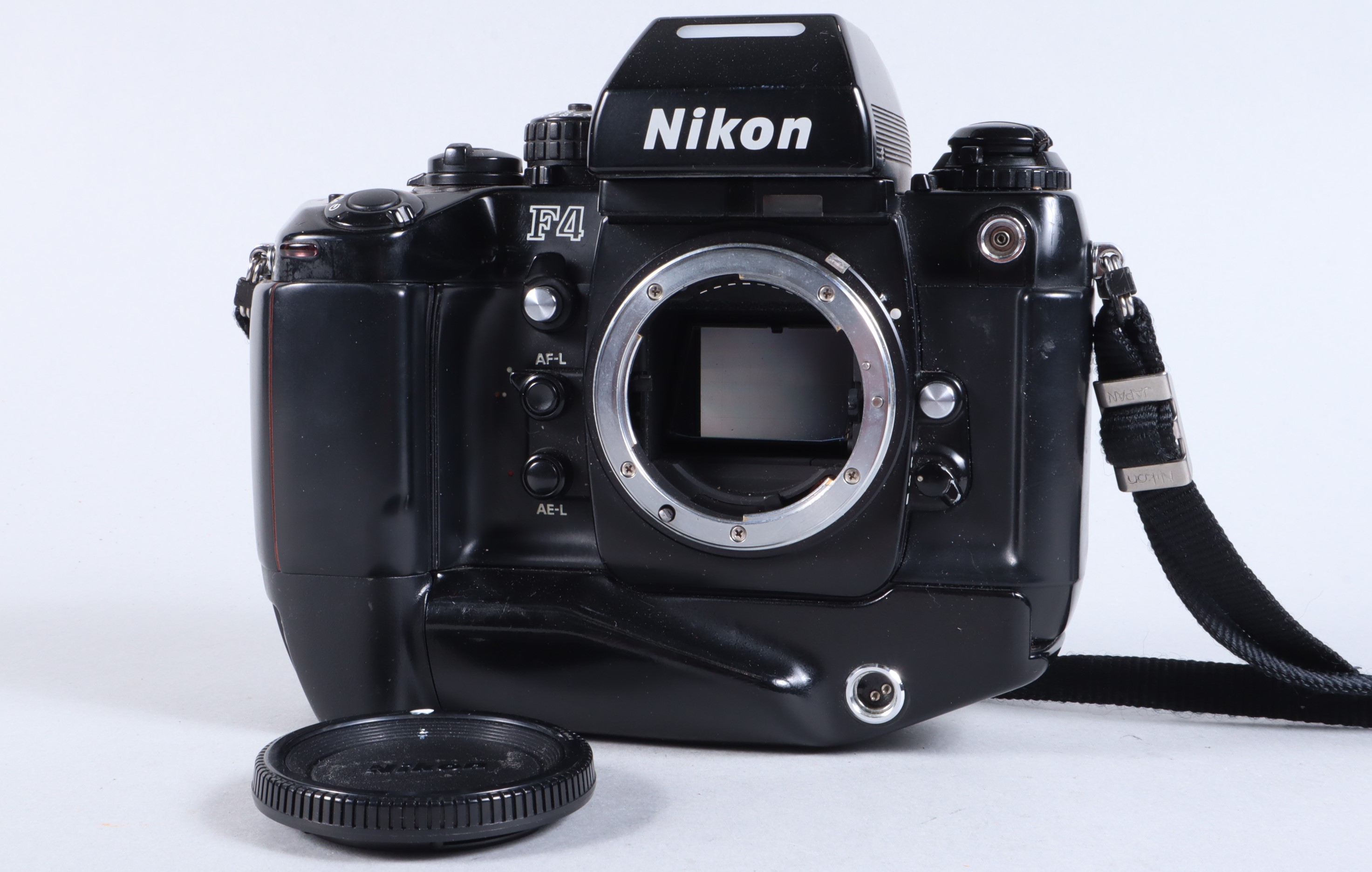 A Nikon F4 Camera Body, serial no 2258779, powers up, appears to function as should, shutter