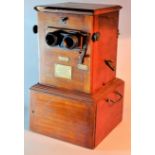 An early 20th Century mahogany 'Le Taxiphote' Stereoscopic Viewer, with seven empty trays, with