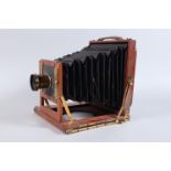 A Half Plate Mahogany Field Camera, unnamed, square-cornered tapered black bellows, double