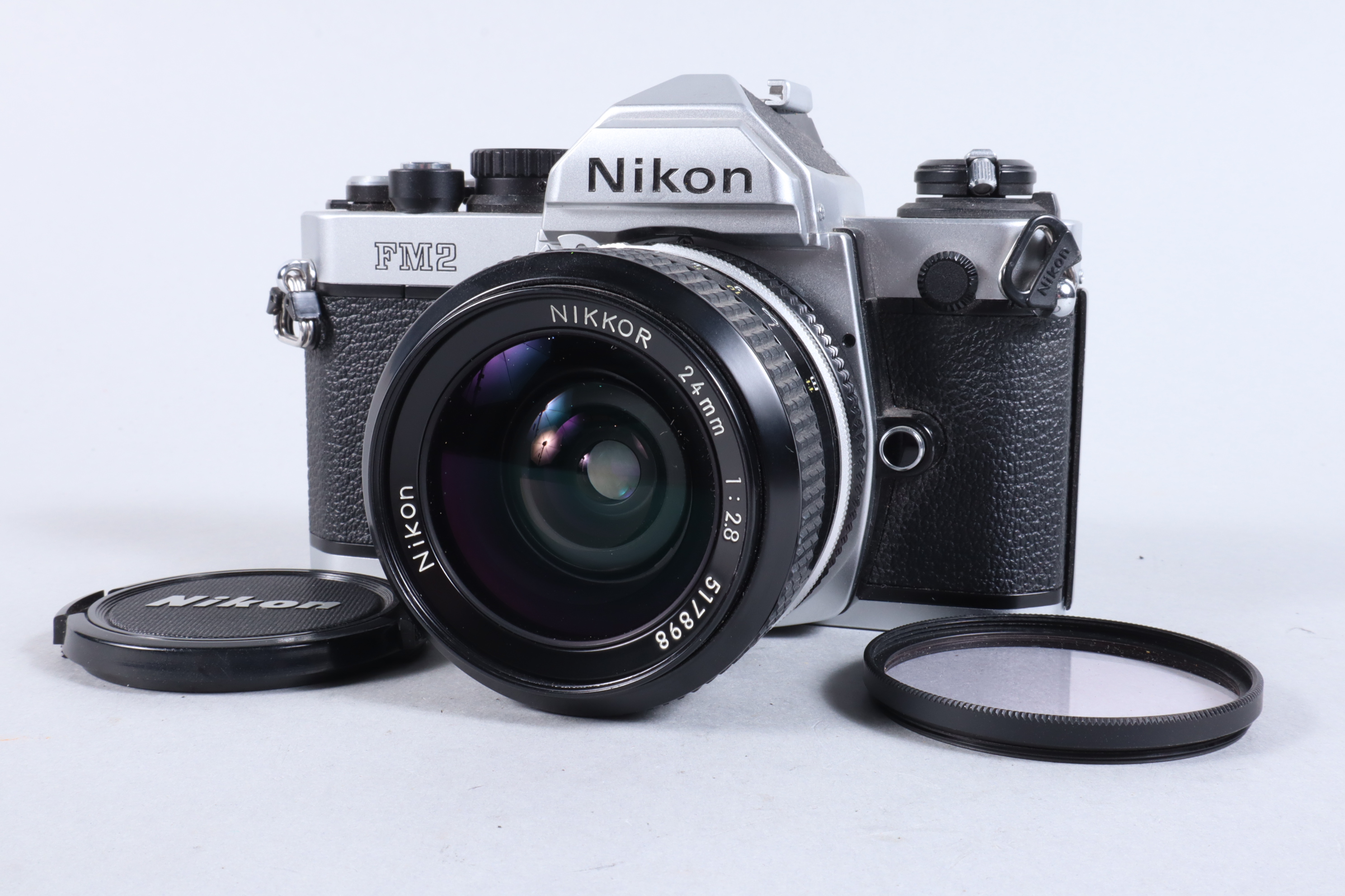 A Nikon FM2 SLR Camera, chrome, serial no 7206888, shutter working, meter responsive, self timer