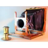 A late 19th Century W H Humphries & Co mahogany and brass 10in x 8in Field Camera, with rising