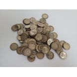 A quantity of pre 1947 George V and George VI shillings, 1200g