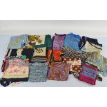 A collection of various silk and polyester lady's scarves, including Hermes of Paris etc
