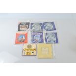 A collection of United Kingdom uncirculated coin collection, from 1980s in card envelopes most