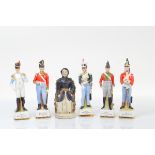 A set of five continental Napoleonic war commemorative models of soldiers, including British