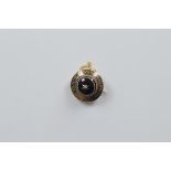 A Victorian onyx and diamond gold and enamel mourning brooch, of circular target design centred with