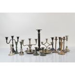 A collection of silver plated and metalware candelabra and candlesticks, including a 1930s three