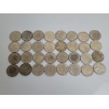 A collection of replica coins from around the world, comprising Hong Kong trade dollars, Edward VIII