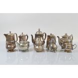 A collection of various silver plated and hotel plate tea and coffee pots, including a two pint