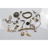 A collection of silver and gold jewellery, including a 9ct gold framed cameo brooch, a silver curb