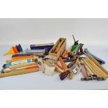 A quantity of workshop tools, including engineer hammers, wood planes, and other items