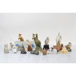 A collection of animal figurines, including two Black Forest examples of bears, various pottery