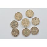 A collection of George V and George VI crowns, including five 1935 examples, and three 1937