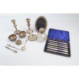 A collection of silver and silver plated ware, including a pair of silver dwarf candlesticks, 14cm