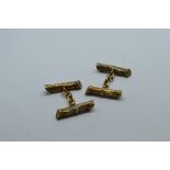 A pair of novelty 9ct gold cufflinks, in the form of tree trunks, united by oval linked chains, 13g