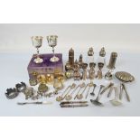 A collection of silver plated tableware, including a cased pair of goblets, three pairs of silver