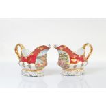 A pair of contemporary Chinese porcelain decorative sauce boats, with painted vignettes of figures