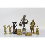 A collection of figural metalware, including a brass model of a gentleman blacksmith, 21cm high, a