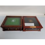 A collection of unpopulated coin display cases and boxes, for various American collections, and