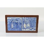 Two Wedgwood blue and white tiles, for July and August, in a mahogany frame, total 19cm x 34.5cm