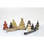 A small collection of various Indonesian, Thai and Asian deities, including seated and reclining